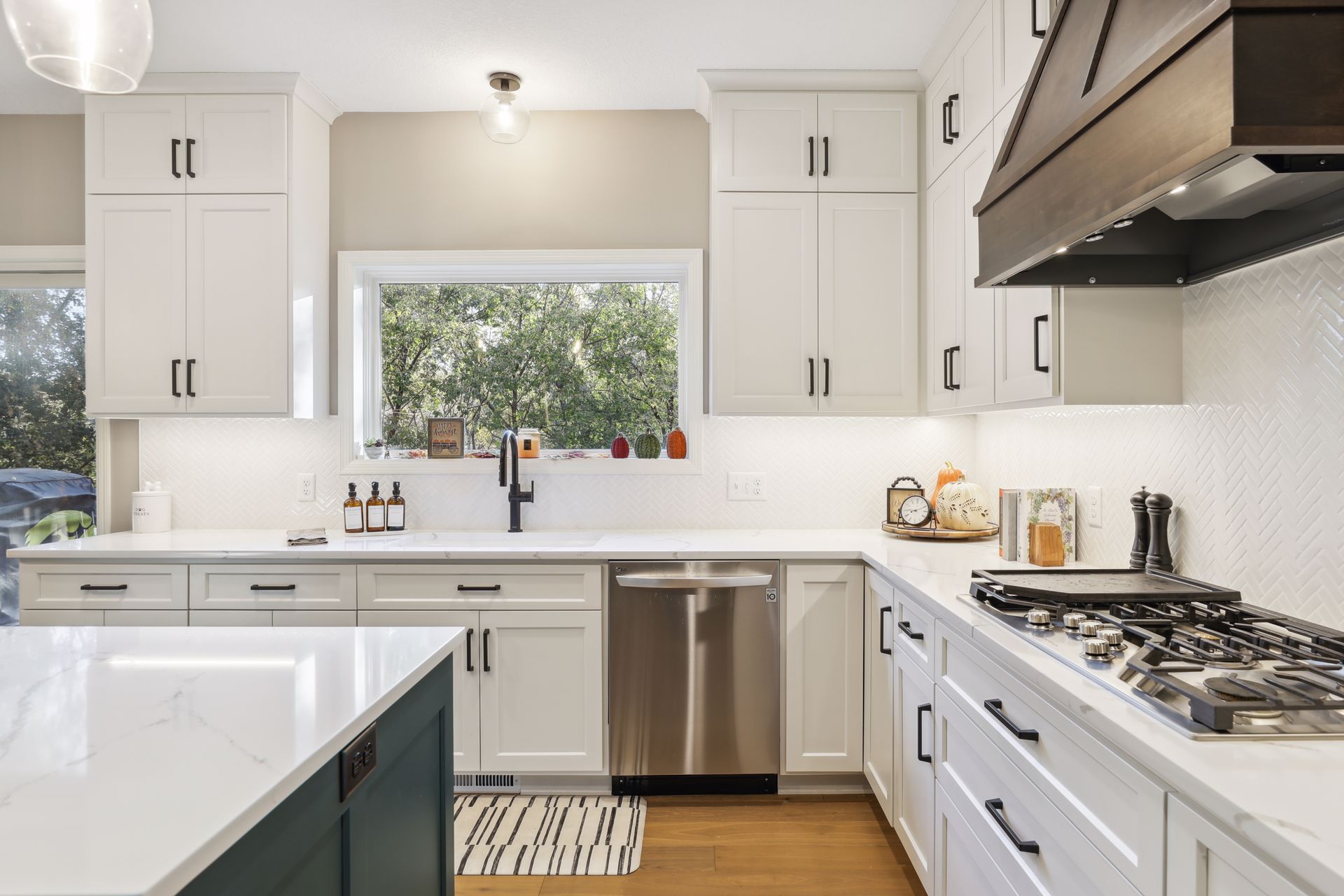 Transitional Kitchen With Contrasting Cabinetry And Statement Lighting Kitchen Remodel by Home Building & Remodeling Experts project photo 5